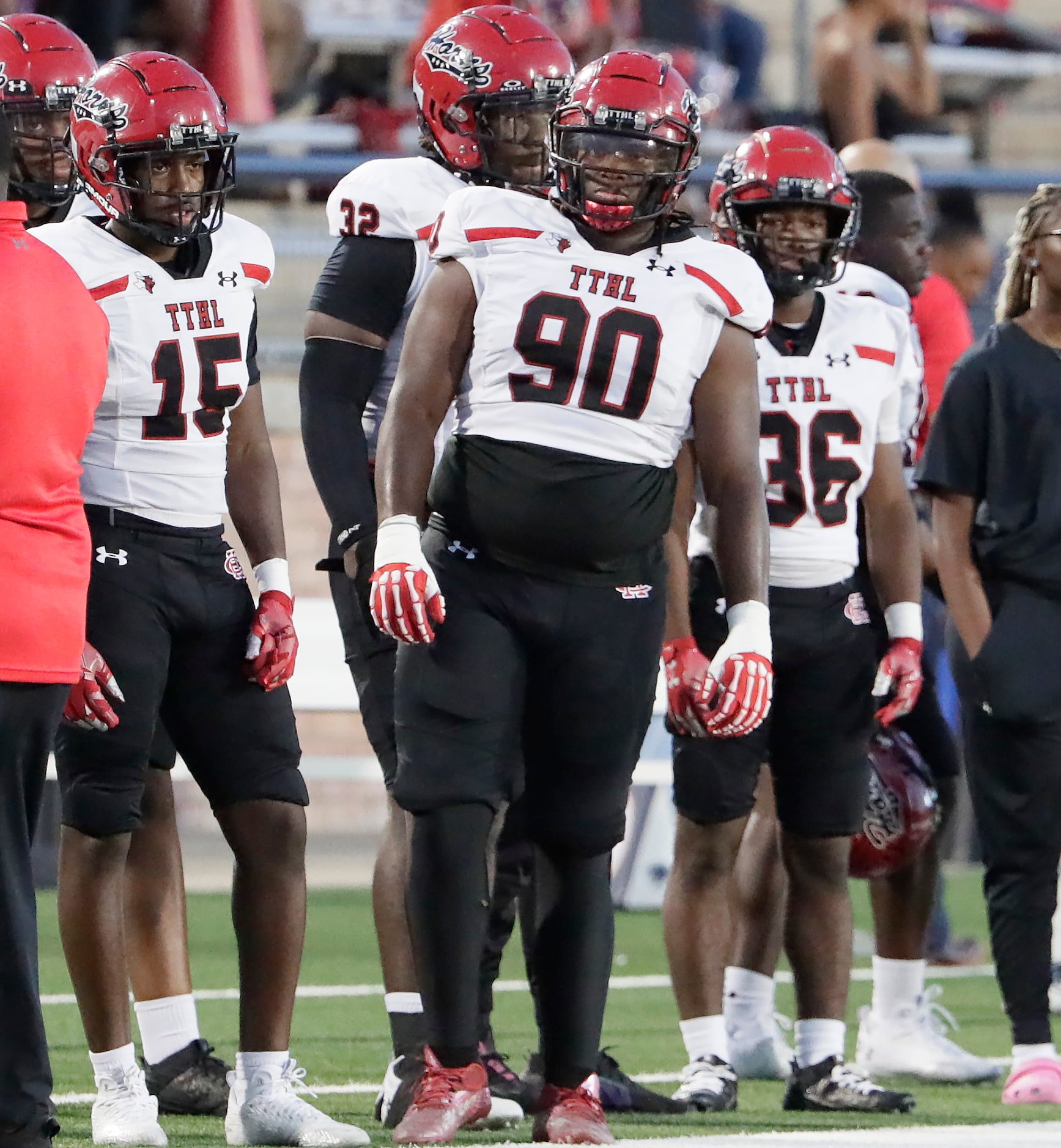 Cedar Hill High School defensive lineman Isiah Coleman (90) on the sidelines during the...