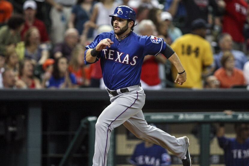 May 12, 2014; Houston, TX, USA; Texas Rangers designated hitter Mitch Moreland (18) scores a...