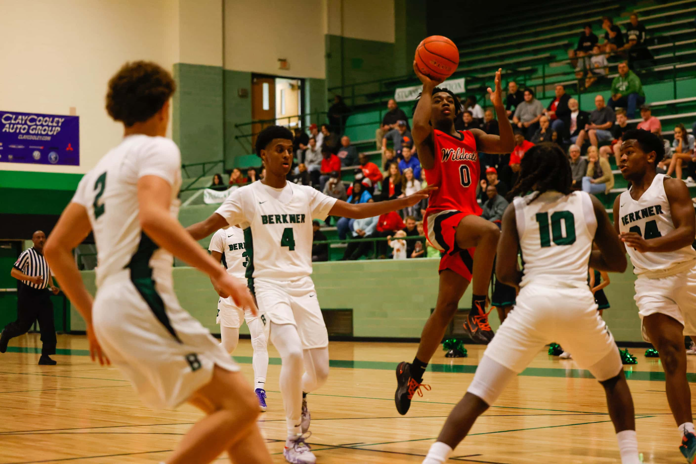 Lake Highlands High School' Jaylen Washington #0 goes for a shot against Berkner High School...