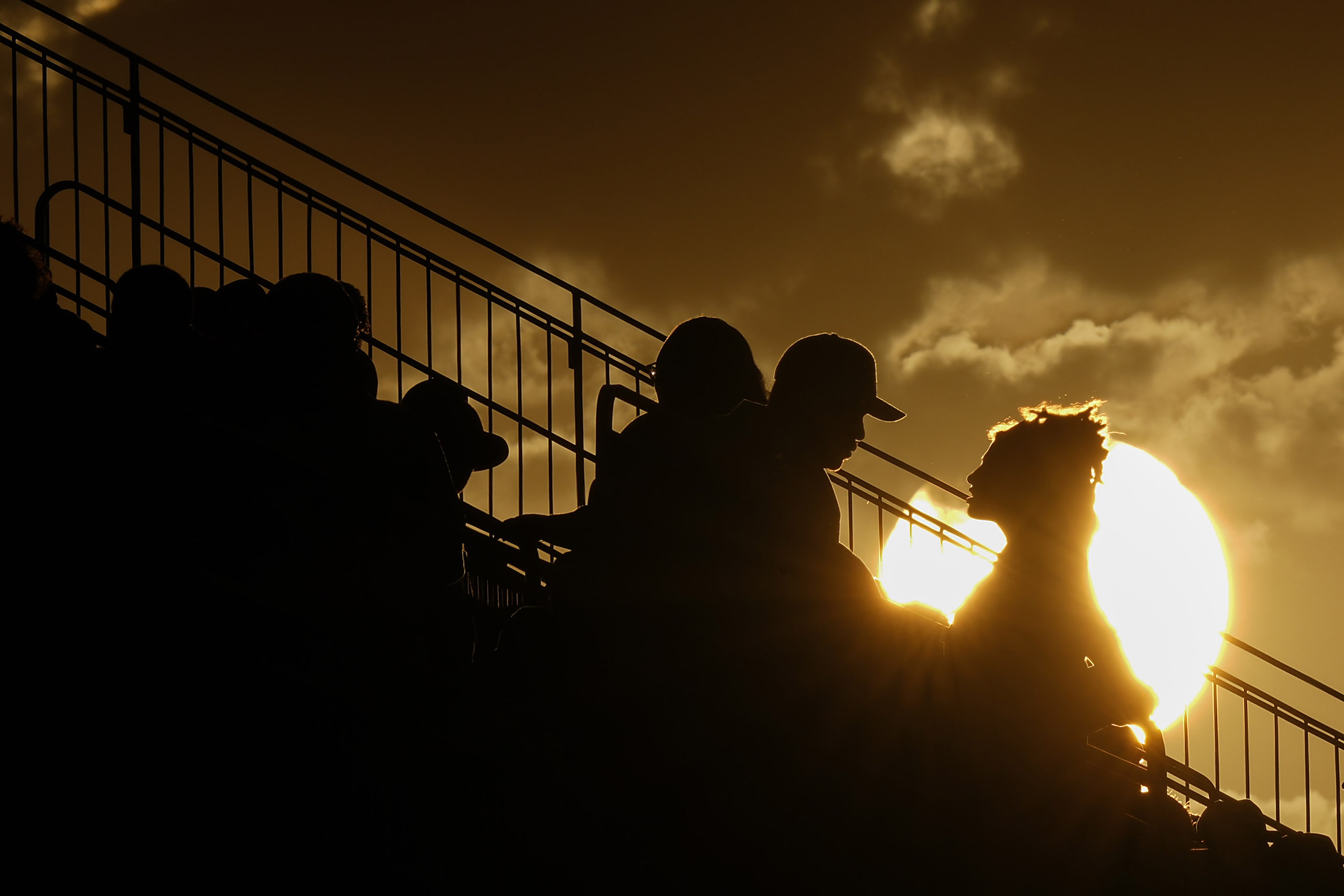 Fans take their seats as the sun sets before a District 11-6A high school football game...