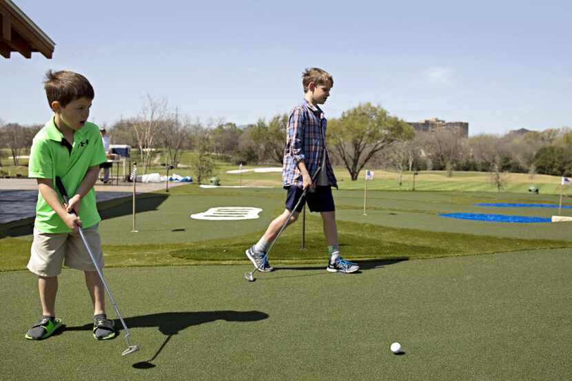 William Grimsley (left), 7, and his 11-year-old brother, Evan, checked out the miniature...