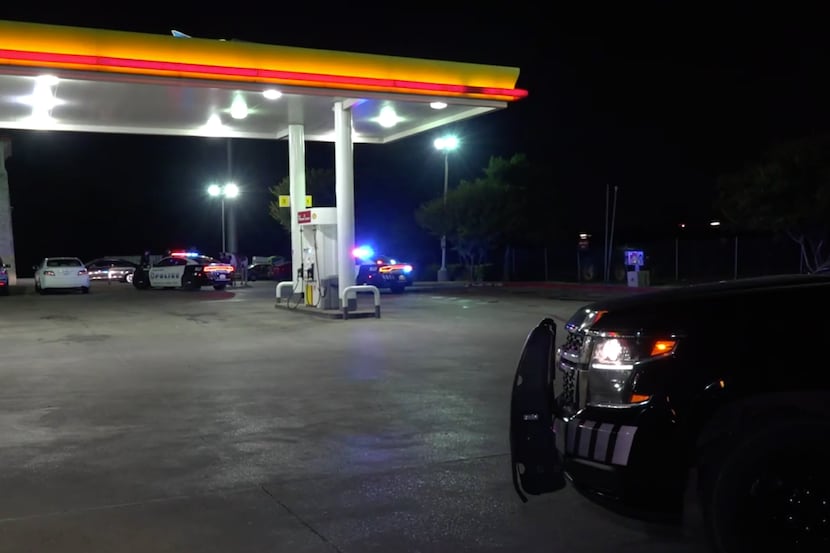 Police at the scene of a shooting in southeastern Dallas, near Interstate 20, on Sunday.