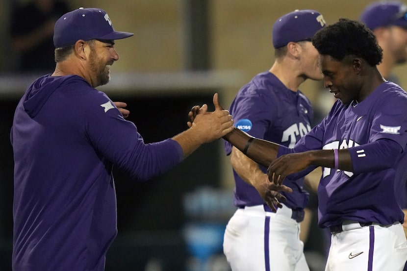 TCU baseball coach Kirk Saarloos, left, congratulates Tre Richardson after an NCAA college...