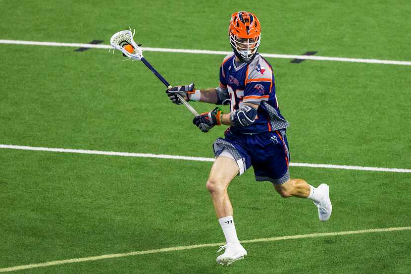 Dallas Rattlers attackman Ned Crotty (22) brings the ball up the field during a Major League...