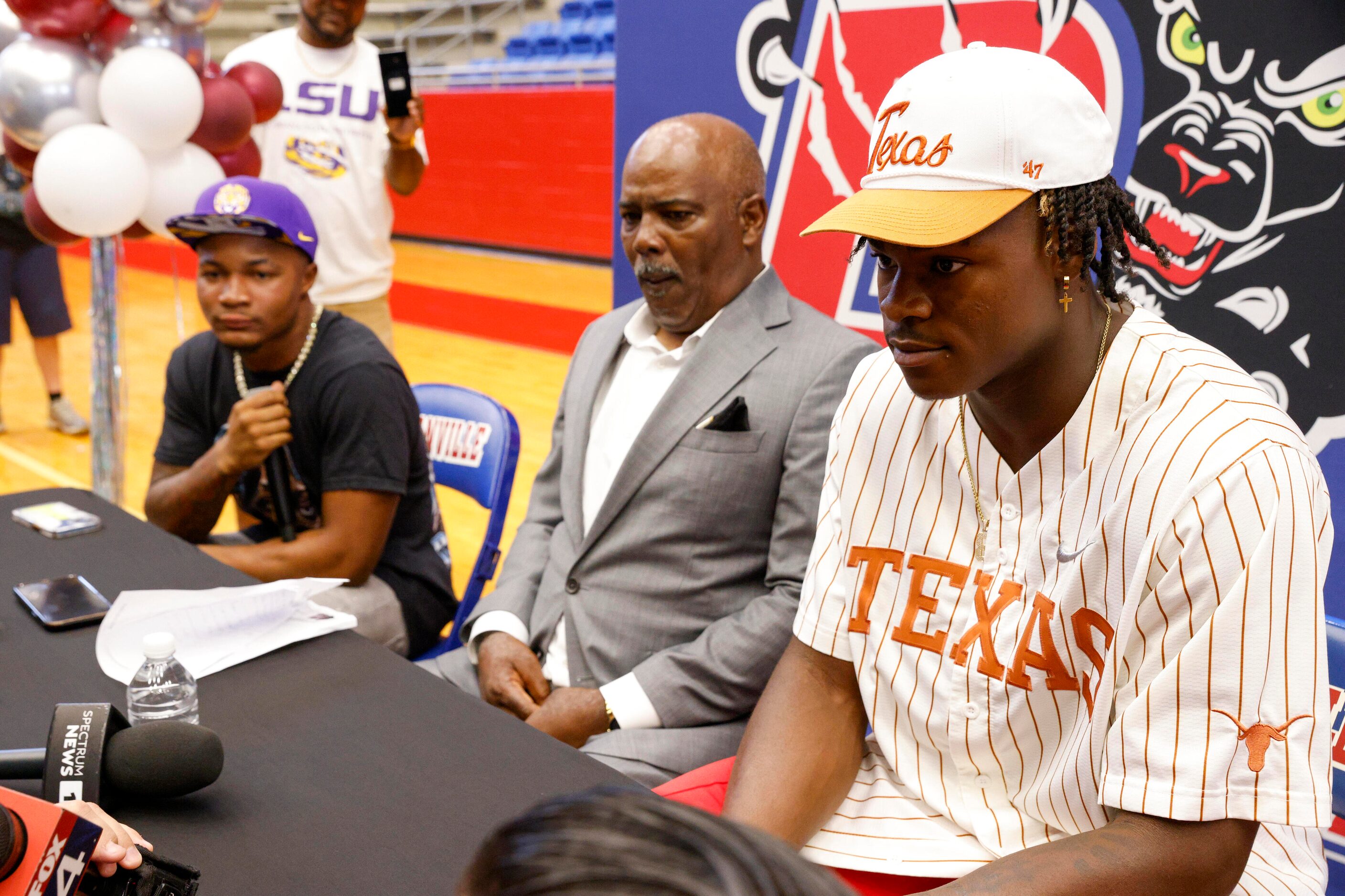 Duncanville running back Caden Durham (left), head coach Reginald Samples (center) and...