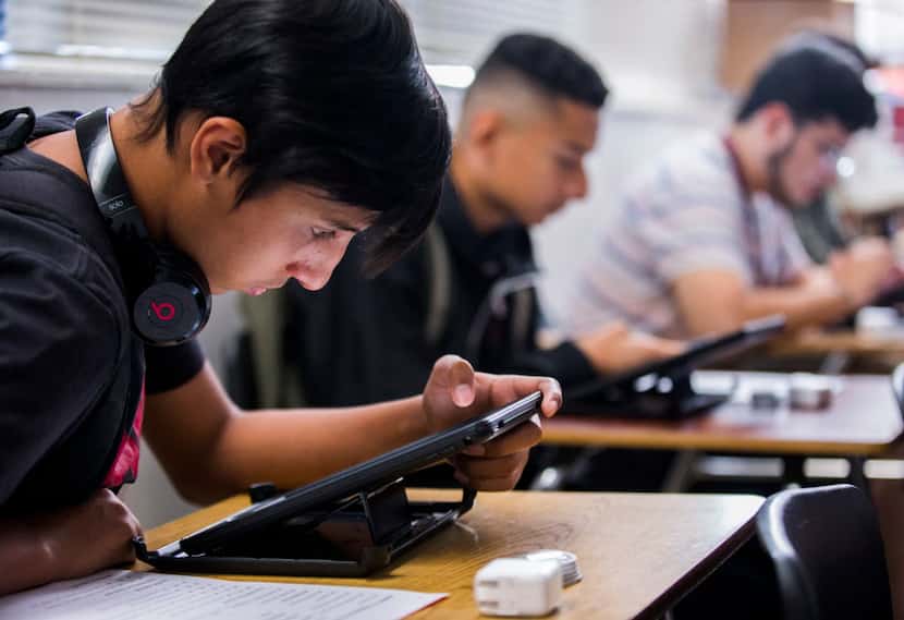 Garland High School student Anthony Vazquez sets up his iPad.