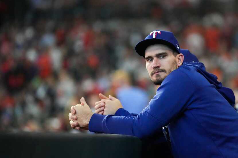 Texas Rangers starting pitcher Andrew Heaney looks out from the dugout before Game 2 of the...