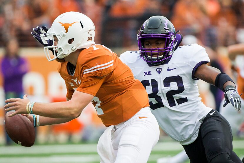 TCU linebacker Travin Howard (32) chases Texas quarterback Shane Buechele (7) from the...