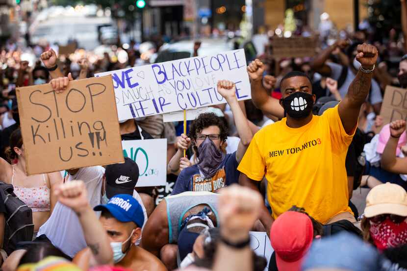 Marchers hold an 8-minute, 46-second moment of silence as they march against police...