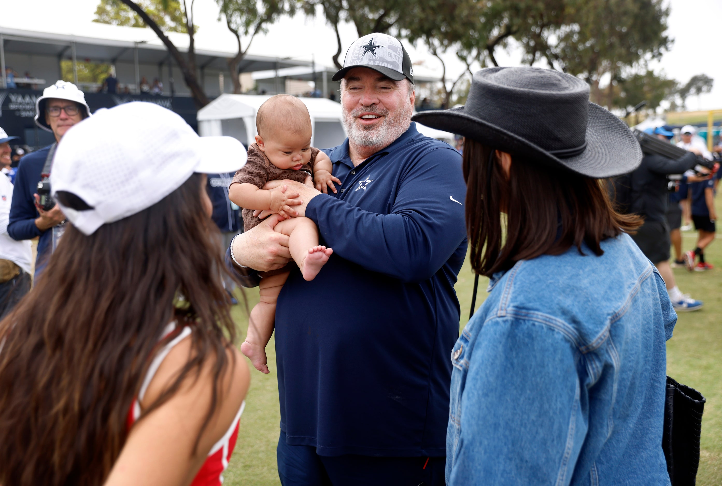 Dallas Cowboys head coach Mike McCarthy plays with Dak Prescott’s baby daughter Margaret...