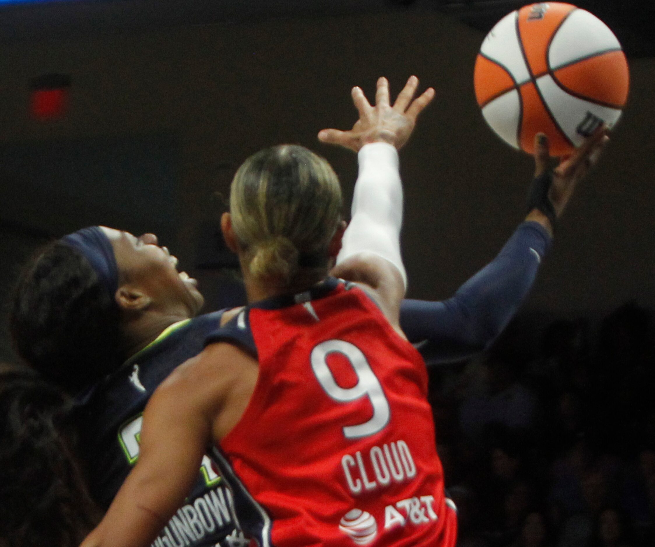 Dallas Wings guard Arike Ogunbowale (24) is fouled by Washington Mystics guard Natasha Cloud...