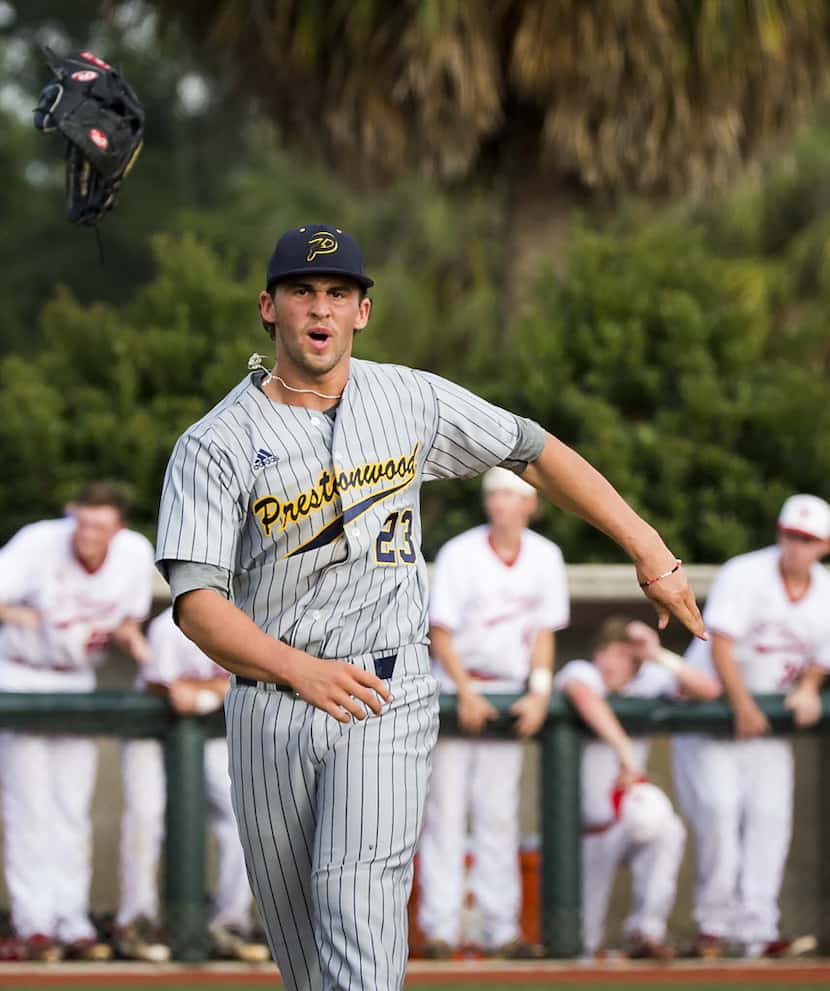 Prestonwood Christian's Alex Scherff tosses his glove in celebration after coming in to...