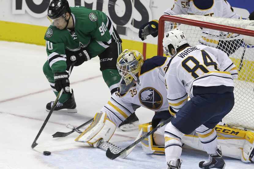 Dallas Stars center Jason Spezza (90) tries to score against Buffalo Sabres goalie Anders...