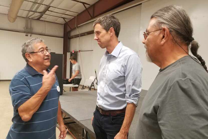 Benjamin Dominguez, left, speaks with Rep. Beto O'Rourke after a town hall meeting in Pecos,...