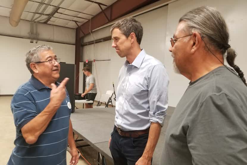 Benjamin Dominguez, left, speaks with Rep. Beto O'Rourke after a town hall meeting in Pecos,...