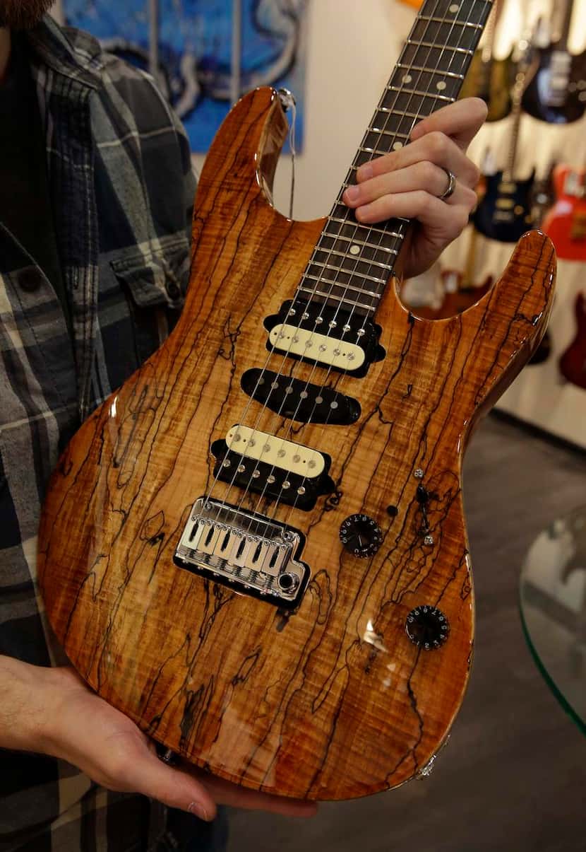 
This Suhr guitar has a spalted maple top and a beautiful finish. Some of their pricey...