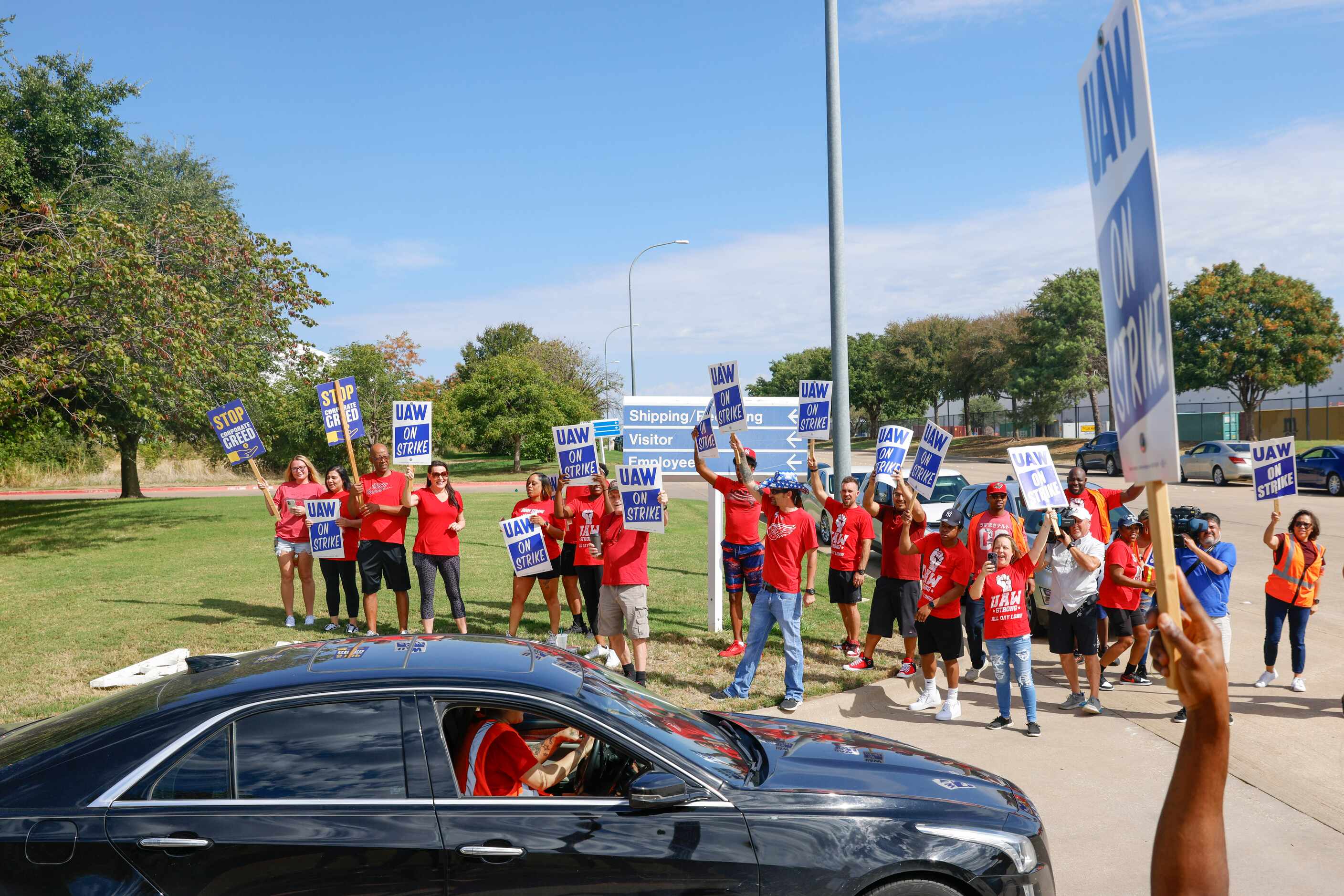 UAW members cheer as employees walkout from the General Motors’ Fort Worth Parts...