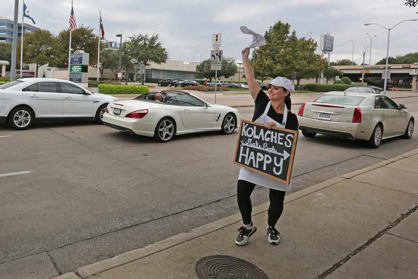 Tara McGraw stands on the sidewalk by Keller Springs Road near the Dallas North Tollway to...