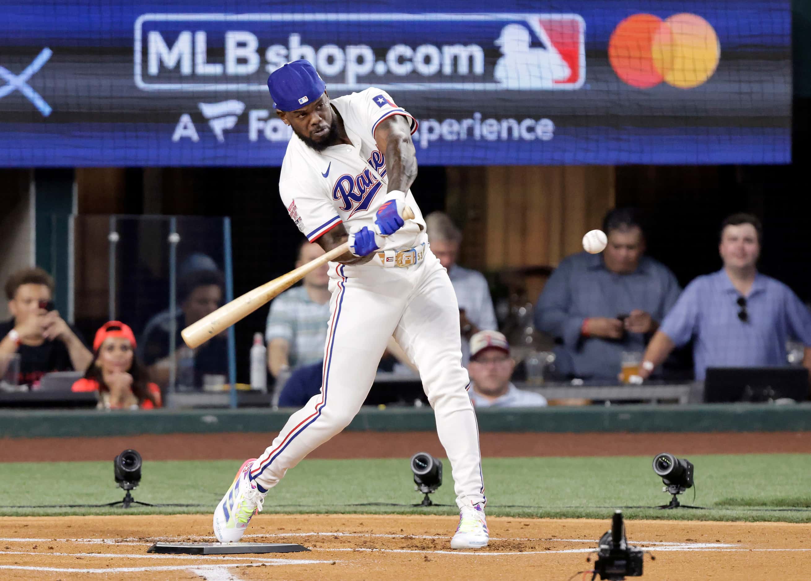 Texas Rangers outfielder Adolis Garcia hits during the first round of the MLB All-Star Home...