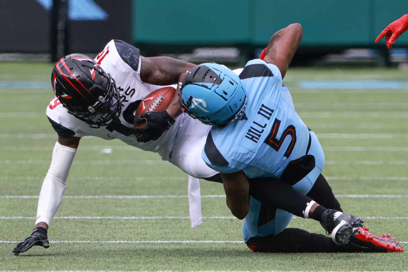 Vegas Vipers wide receiver Geronimo Allison (19) is tackled by Arlington Renegades defensive...