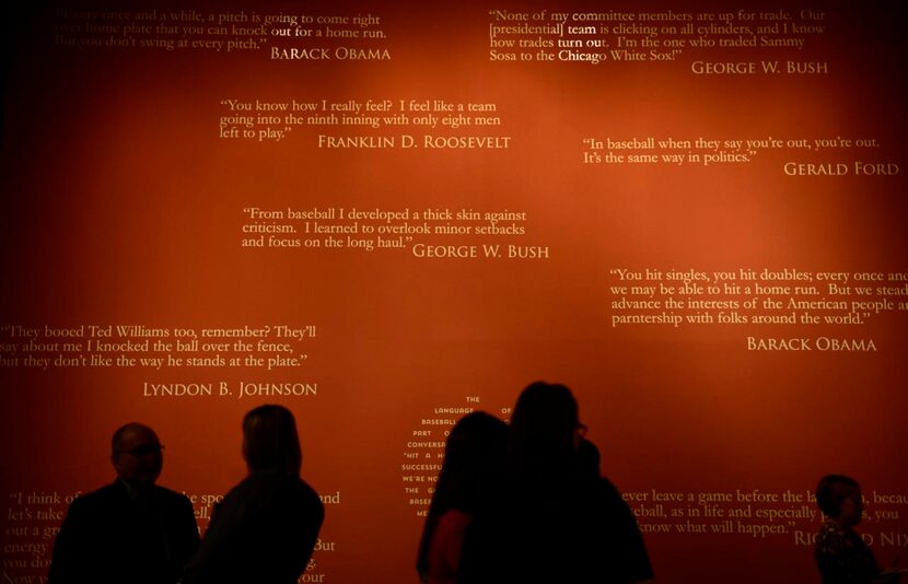 
Baseball quotes made by past presidents are displayed on a wall.
