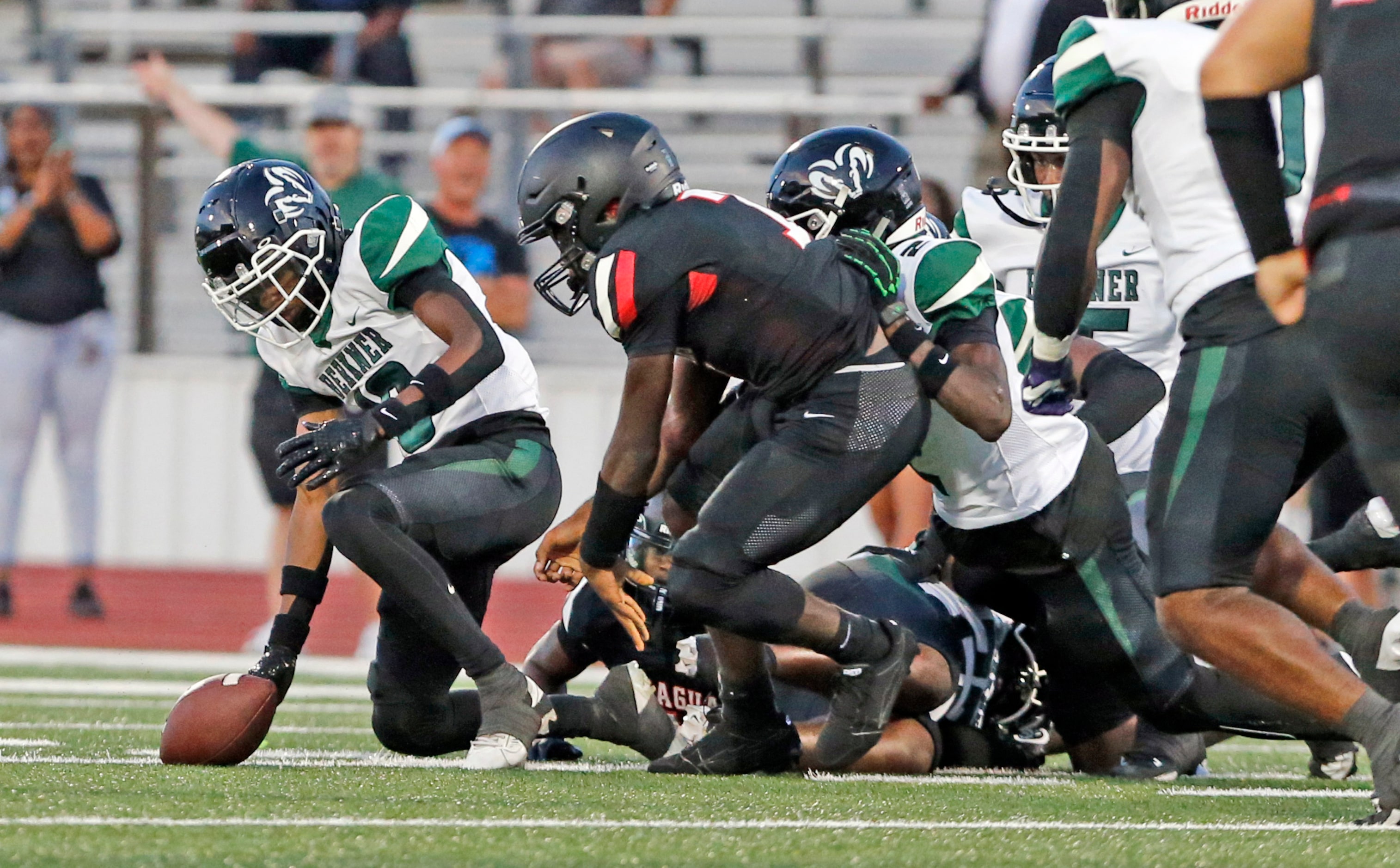 Players, including Mesquite Horn’s Tra Gaston, left, chase a loose ball during the first...