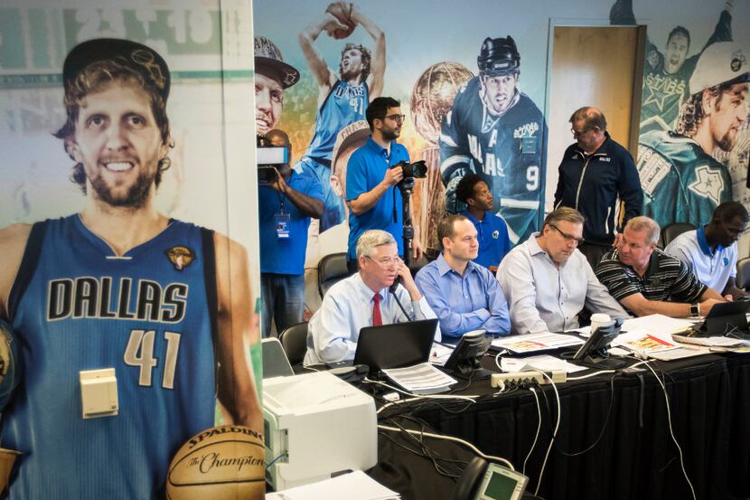 FILE - Seated at the table from left, Mavericks assistant GM Keith Grant, director of...