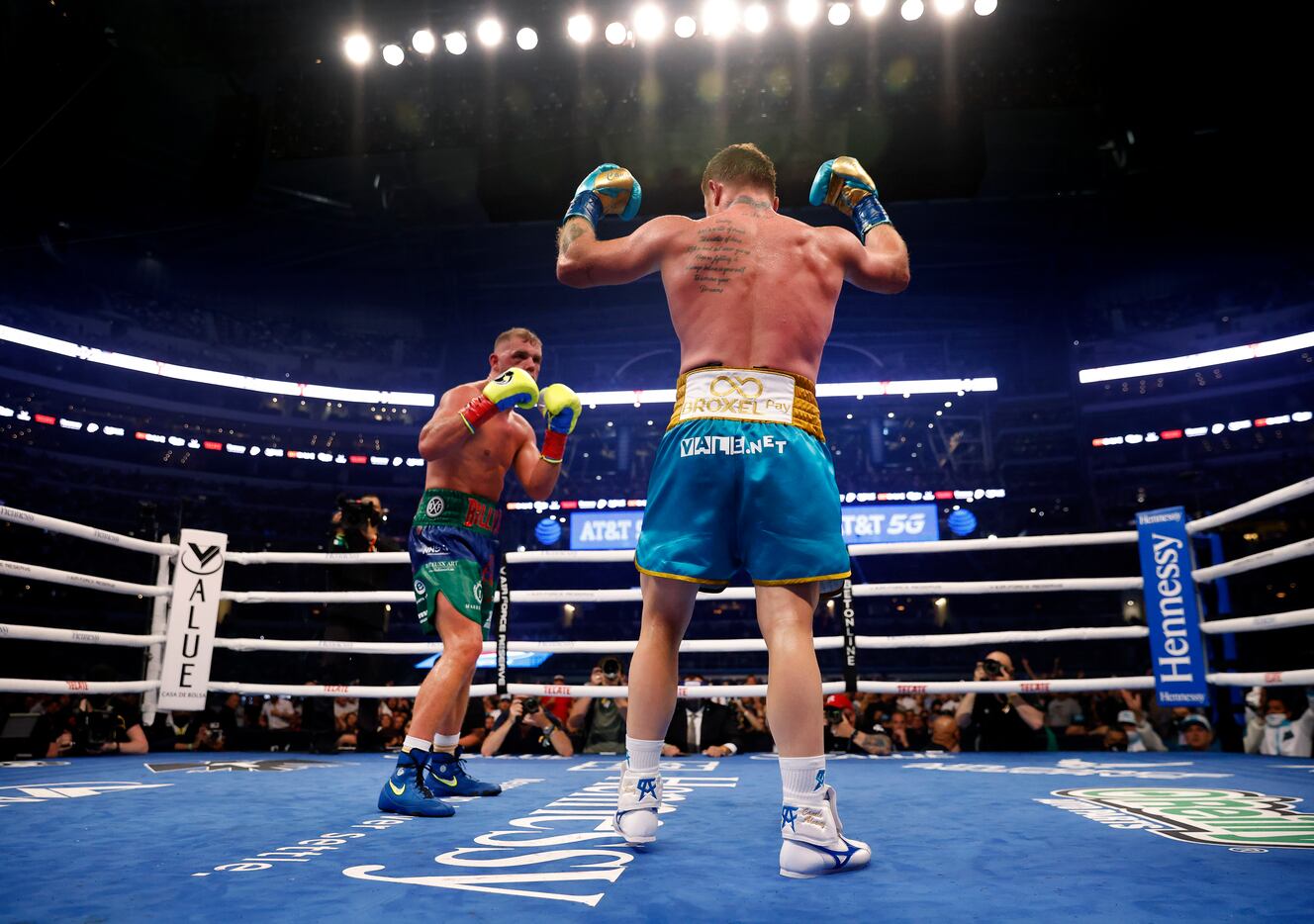 Boxer Canelo Alvarez (right) encourages the crowd to get louder as he has Billy Joe Saunders...