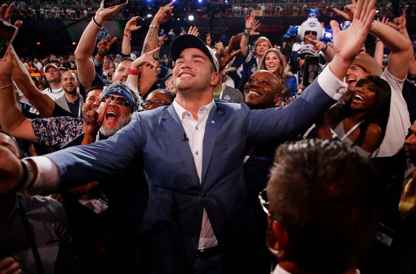 Offensive lineman Connor Williams takes a selfie with fans after being selected for the...