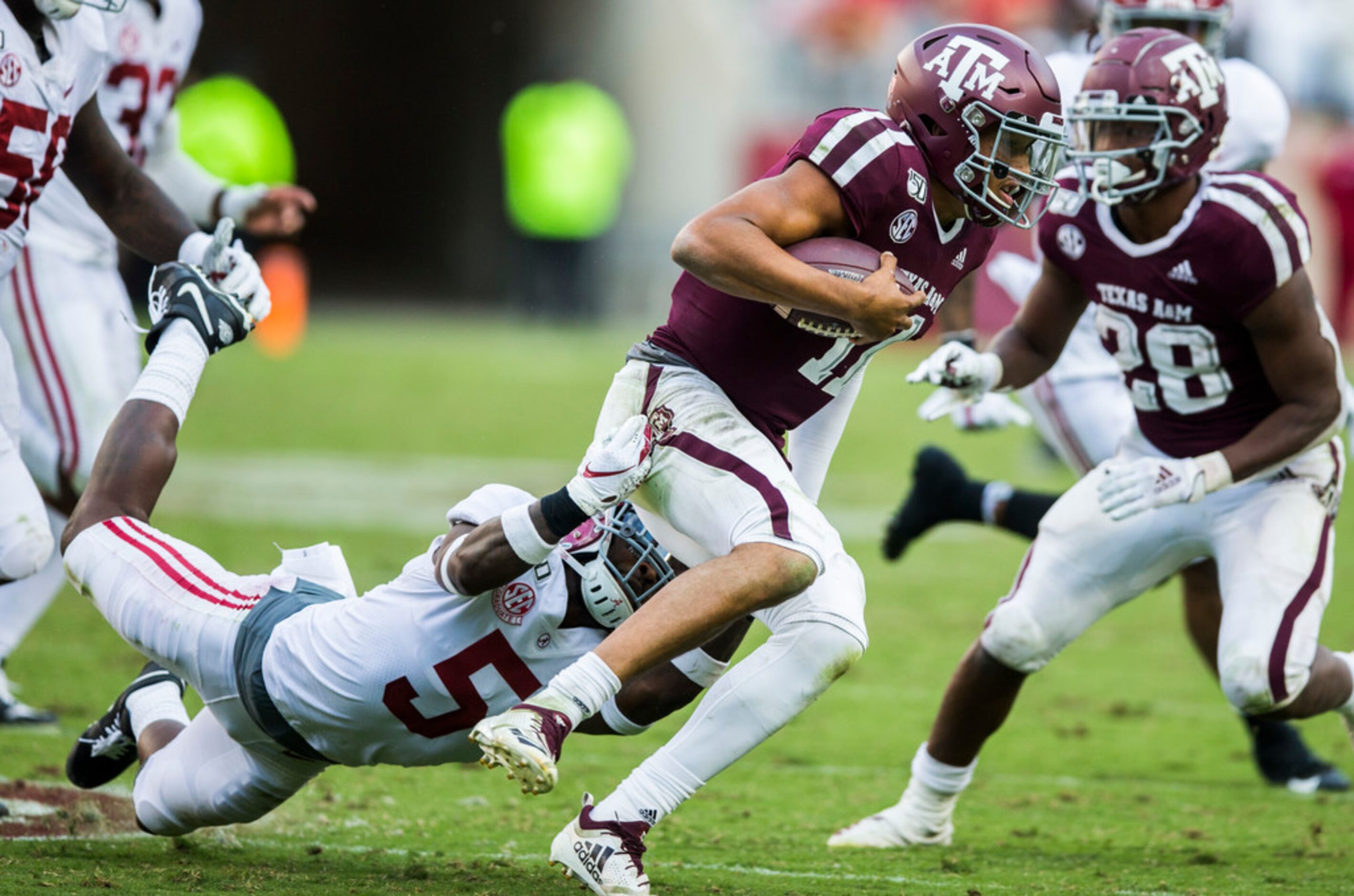 Texas A&M Aggies quarterback Kellen Mond (11) is tackled by Alabama Crimson Tide defensive...