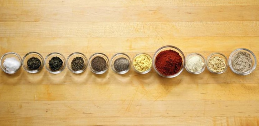 The mix of herbs and spices listed on the handwritten scrapbook recipe. 