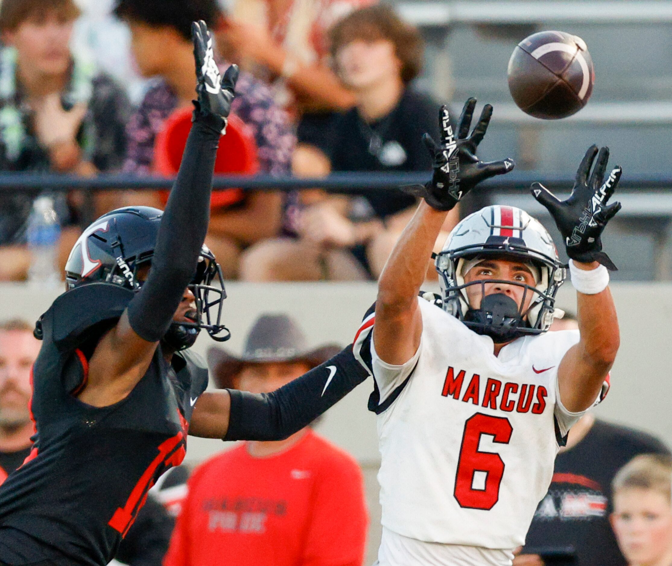 Flower Mound Marcus wide receiver Rhett Garza (6) catches a pass against a defending Euless...