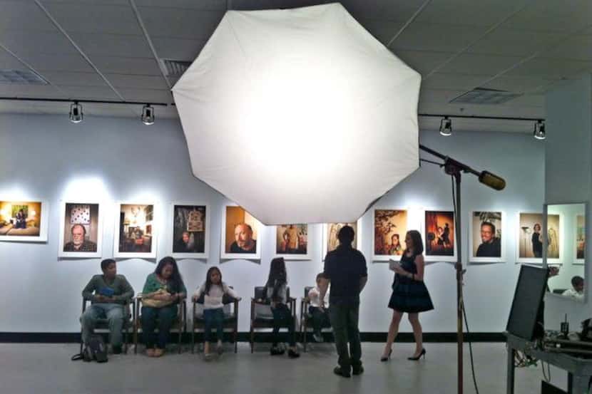 
People visit the James Bland Photography space  at Valley View Center at Dallas Midtown...