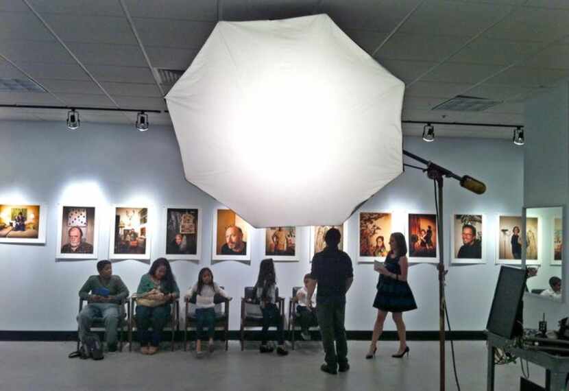 
People visit the James Bland Photography space  at Valley View Center at Dallas Midtown...