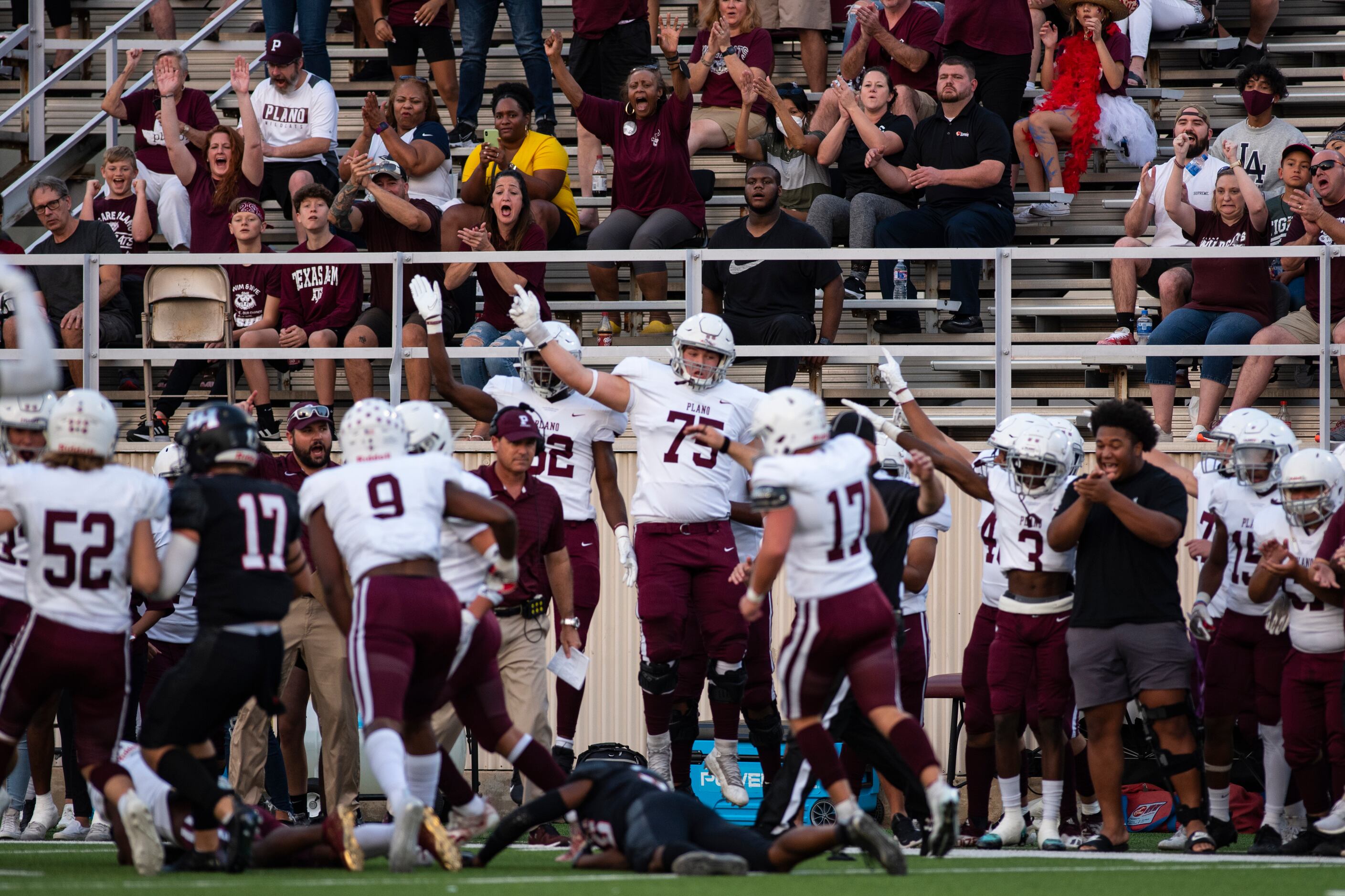 Plano Senior High School players celebrate after recovering a fumble during Lake HighlandÕs...