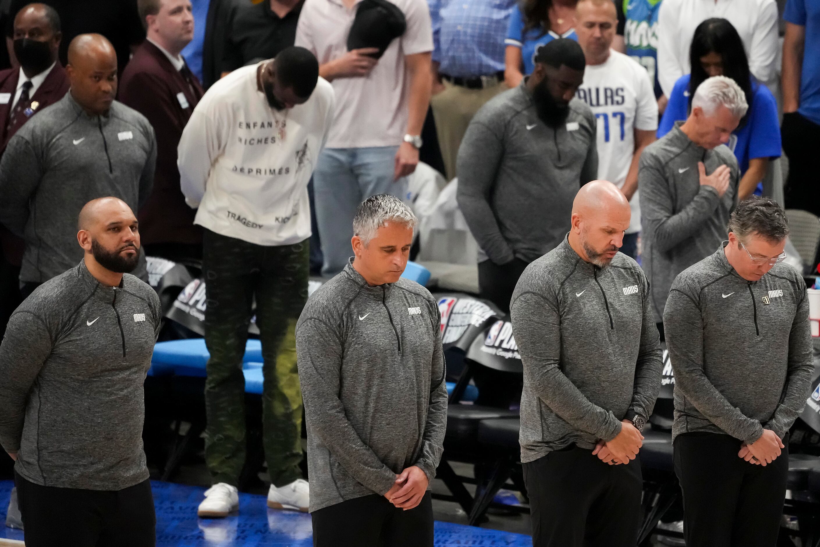 Dallas Mavericks head coach Jason Kidd (second from right) stands with fellow coaches,...