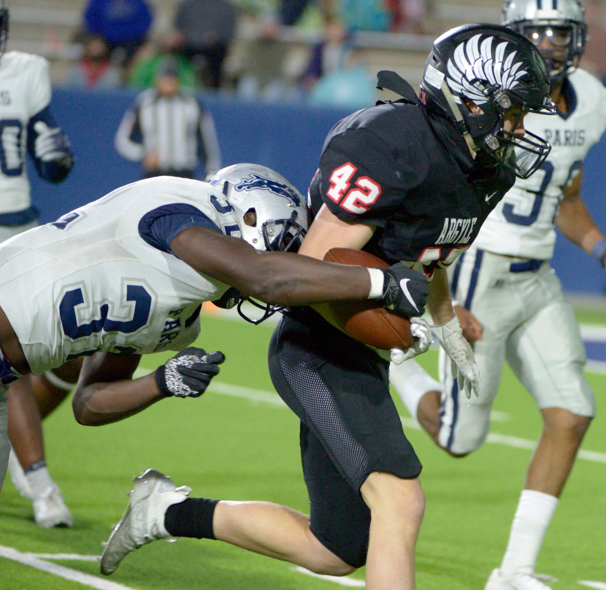 Paris’ Keshawn Wallace (32) forces a fumble on Argyle’s Peyton Shoemake (42) in the second...