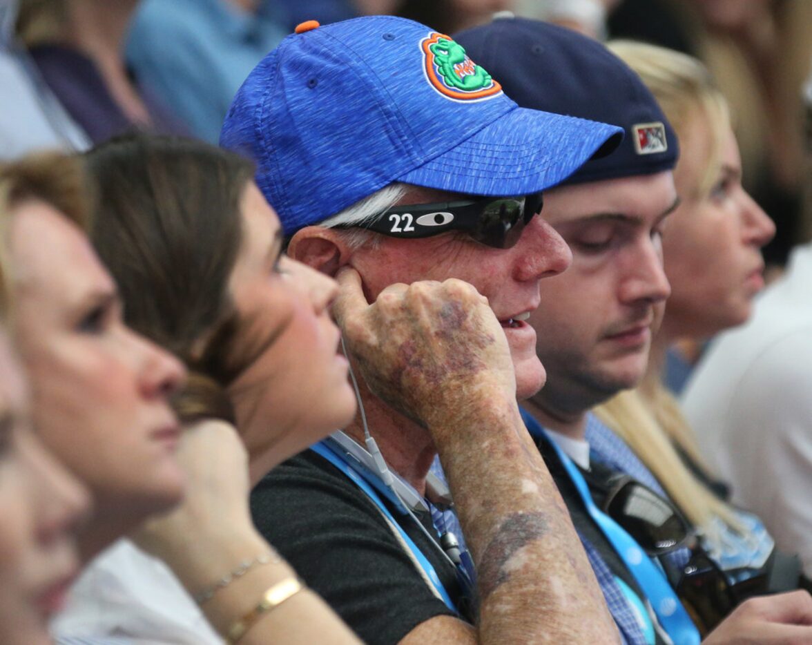 Pete Lane, who is blind, listens from the stands as Dallas Cowboys Hall of Famer Emmitt...