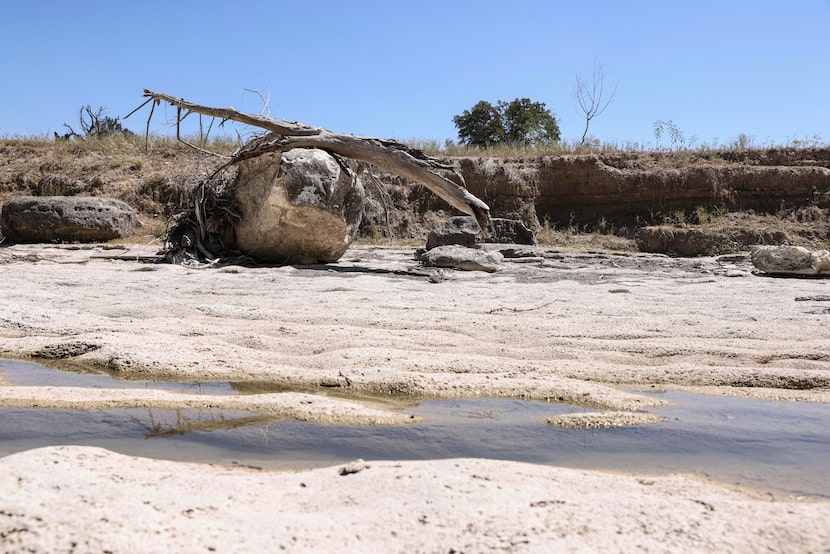 The Guadalupe River flows in crevices of its rock bed, Wednesday, August 10, 2022, in...