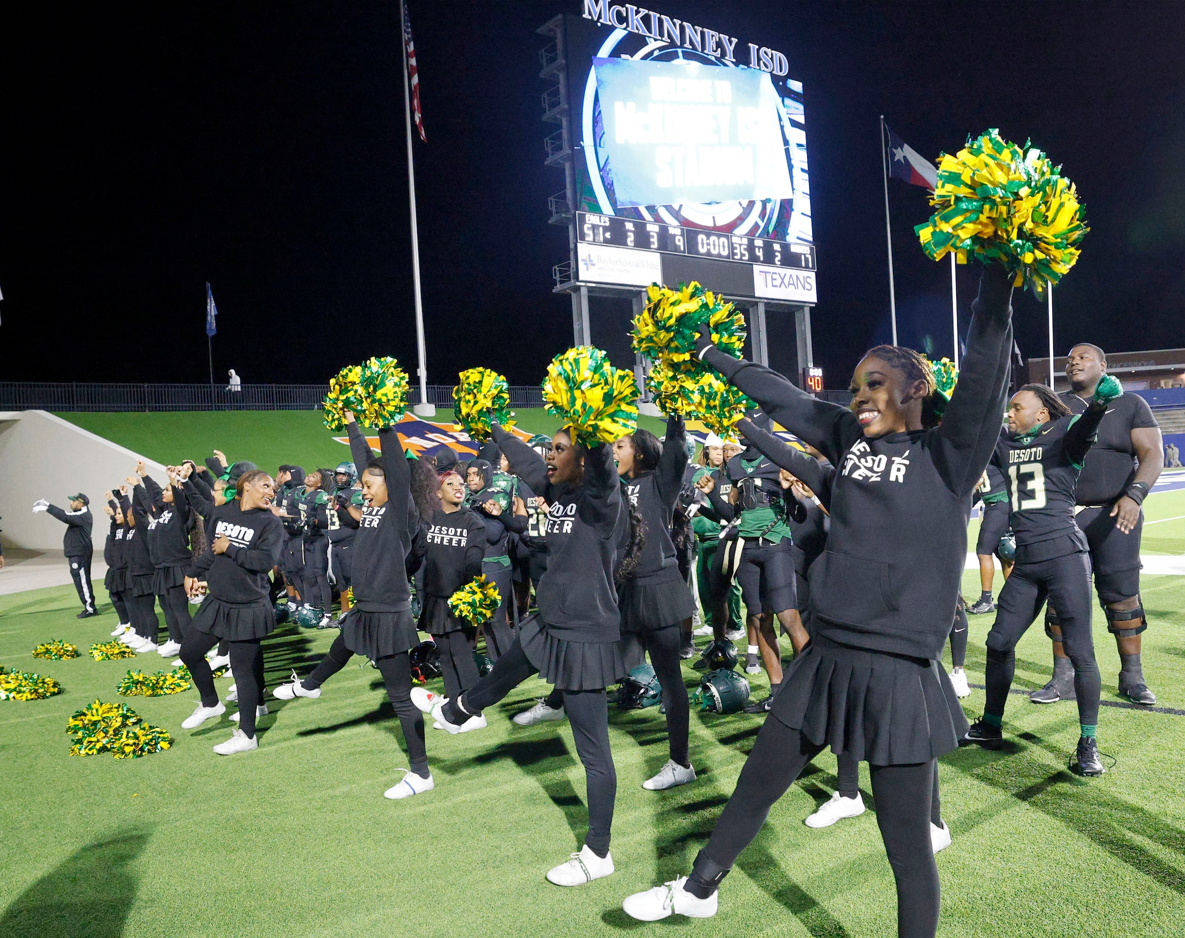 DeSoto’s cheerleaders celebrate their victory against Wylie East after a high school...