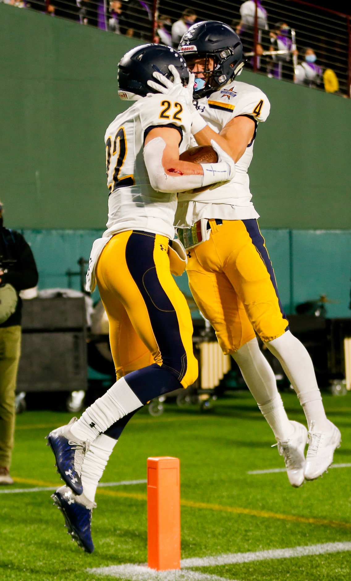 Highland Park's Brooks Bond (22, left) celebrates his first touchdown against Frisco...