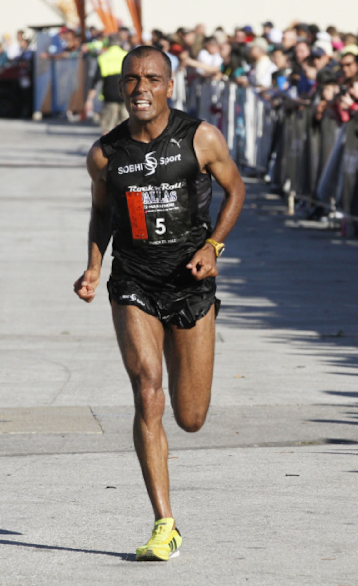 Benazzouz Slimani runs in the Dallas Rock 'N' Roll half marathon on Sunday, March 25, 2012.