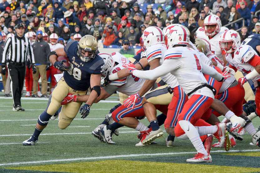 Navy's fullback Anthony Gargiulo runs in for a touchdown in the first quarter of an NCAA...