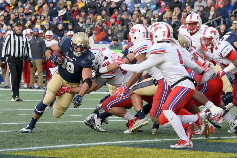 Navy's fullback Anthony Gargiulo runs in for a touchdown in the first quarter of an NCAA...