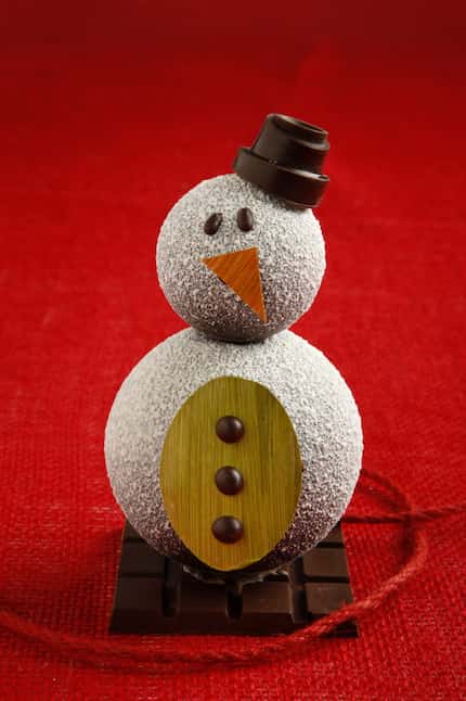 Carl is a hand-painted snowman that costs $25 at Kate Weiser Chocolate. Customers are...