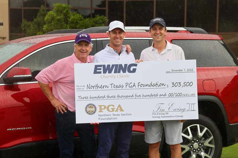 From left, Fin Ewing, Jake McCullough, Finley Ewing display the check for the funds raised...