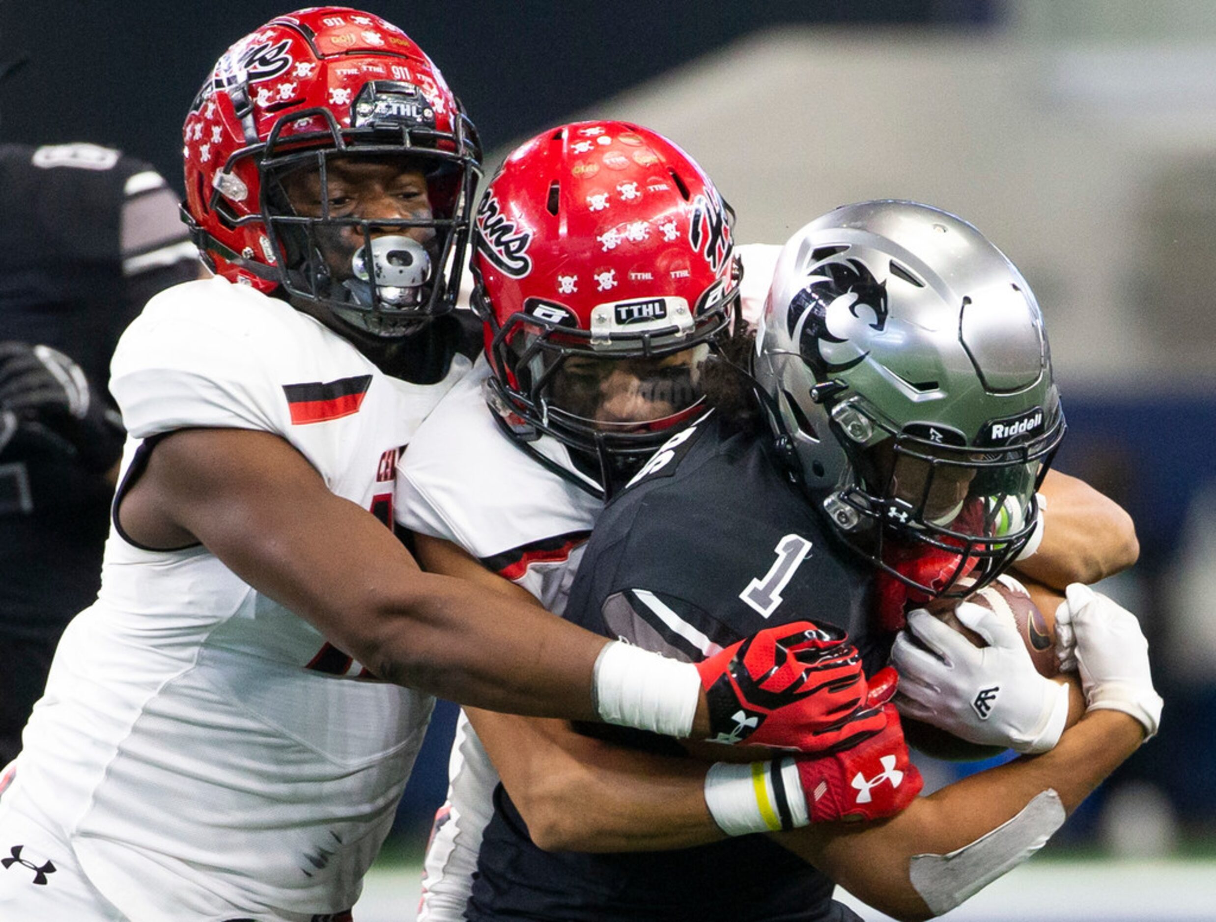 Cedar Hill defense takes down Denton Guyer running back Kaedric Cobbs (1) during the Class...