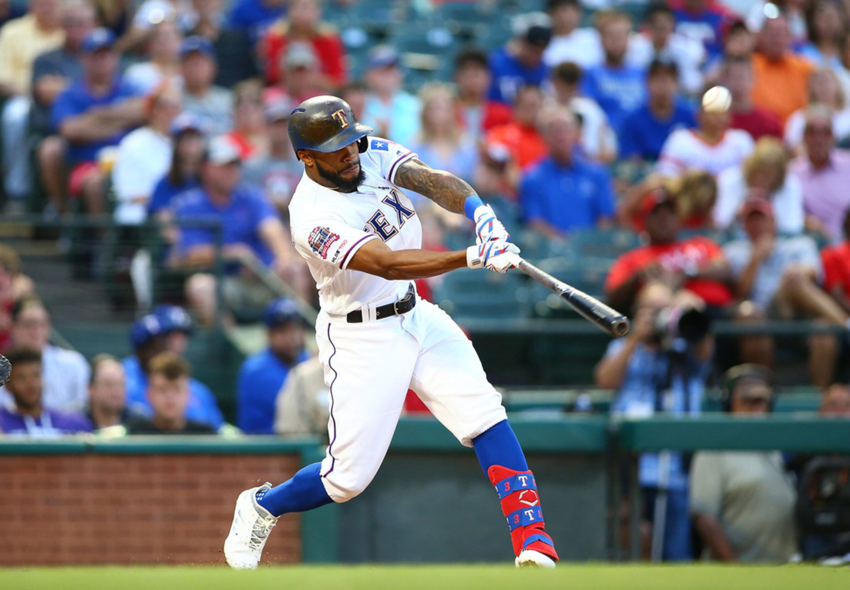 Delino DeShields of the Texas Rangers hits a single in the third inning against the...