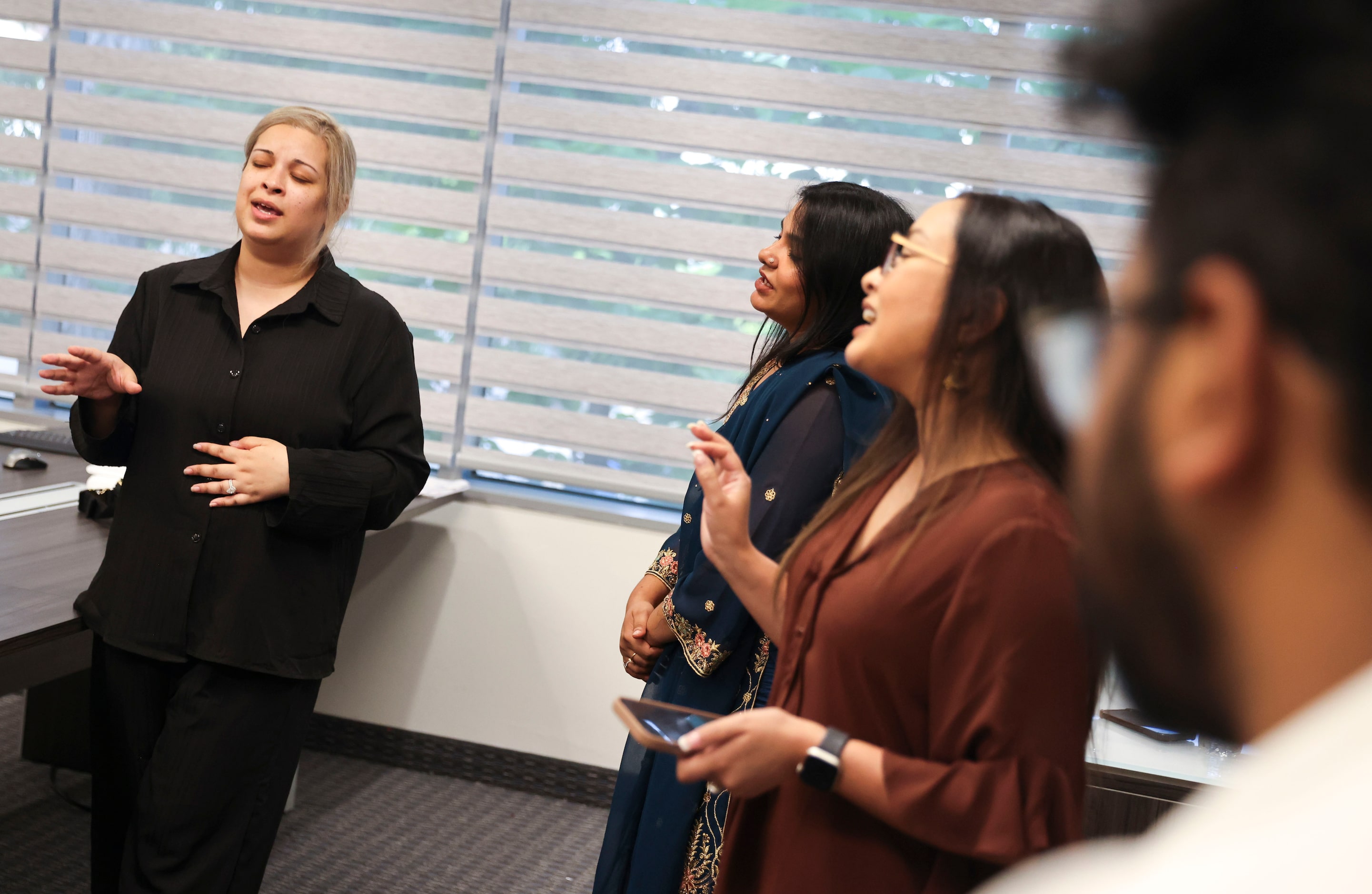 Adiba Mobin (left), with Bangladesh Association Of North Texas rehearses a song with her...