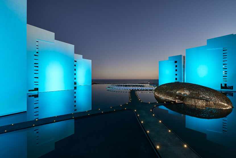 With the hotel exterior lit up at night, Mar Adentro has an otherworldly look. The modern...